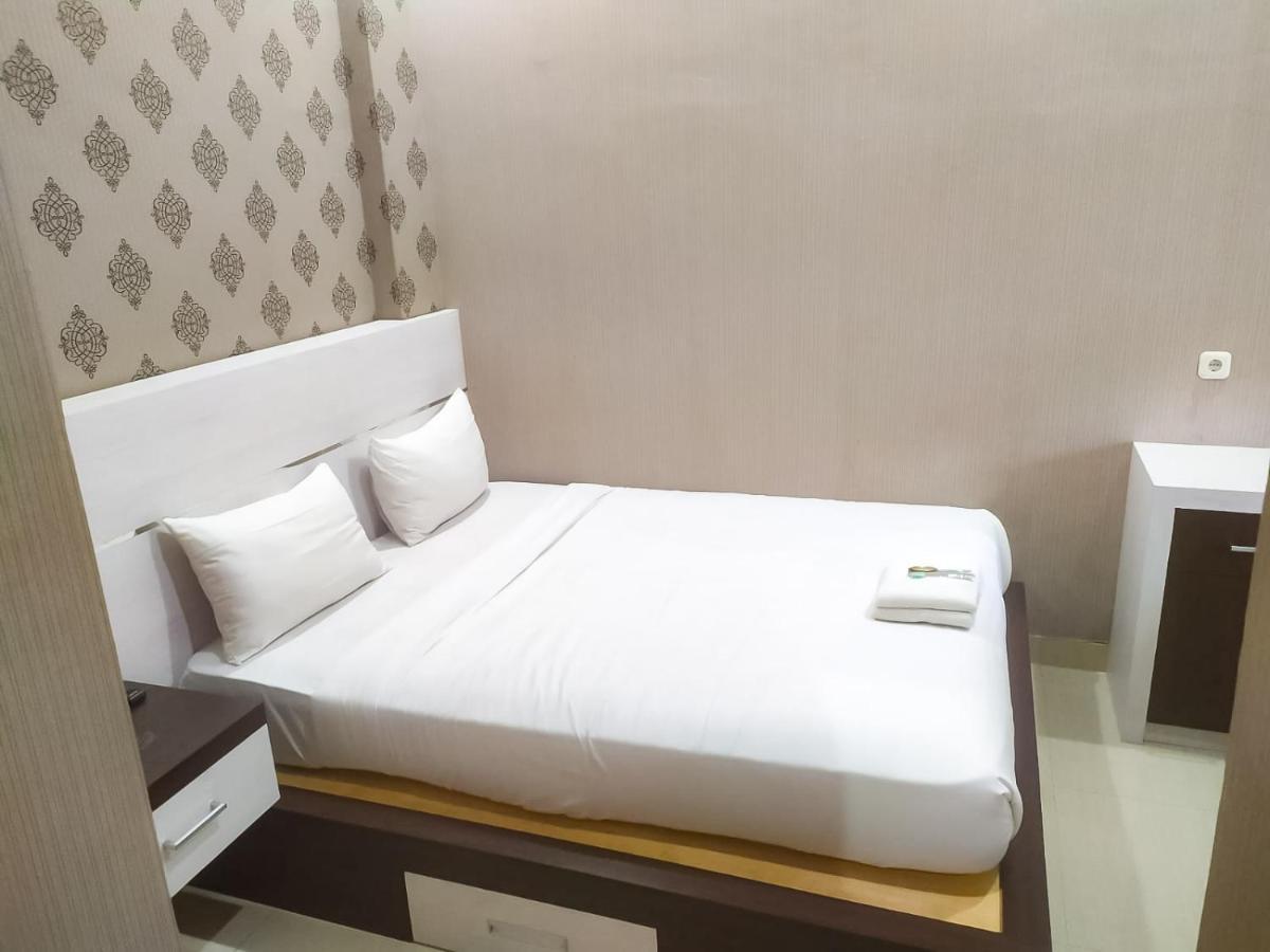 ホテル Reddoorz Syariah Near Sultan Syarif Kasim II Airport プカンバル エクステリア 写真
